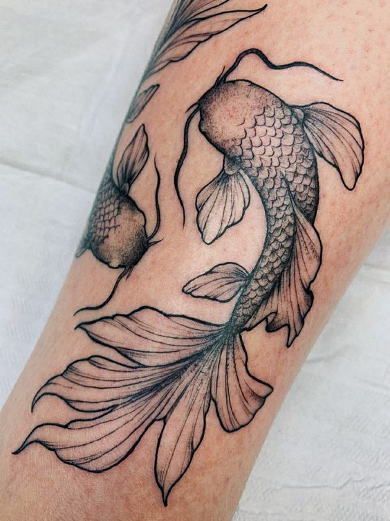 12 BEAUTIFUL FISH TATTOO DESIGNS FOR MEN AND WOMEN