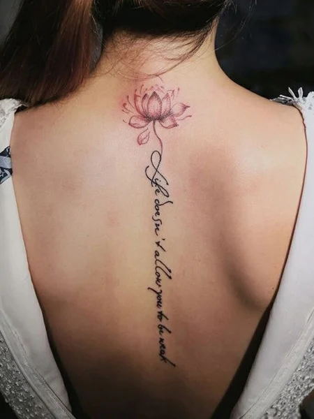 Lotus flower tattoo on the spine