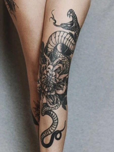 Snake tattoo on legs