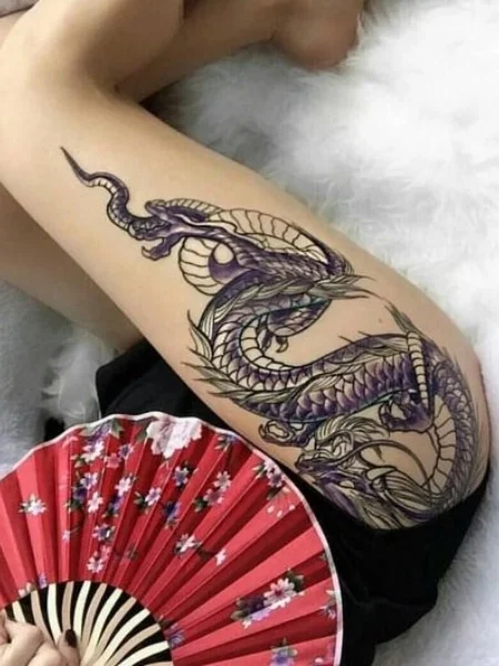 Dragon tattoo on legs