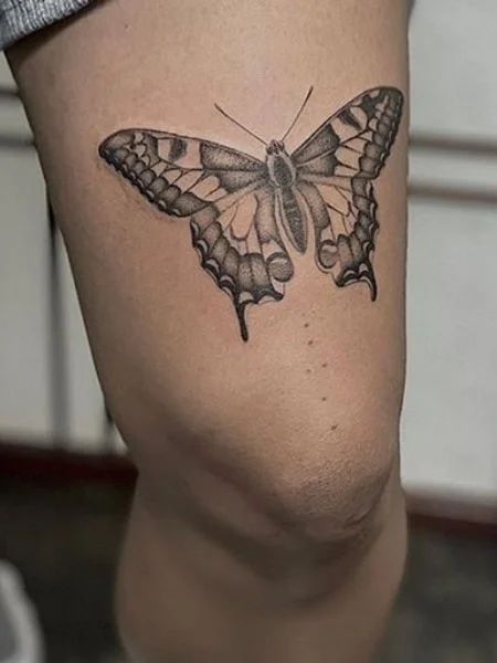 Butterfly tattoo on legs