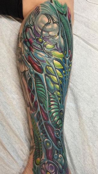 Biomechanical tattoos on legs