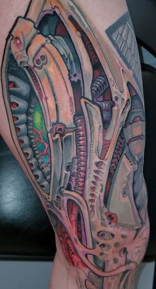 Biomechanical tattoos on legs