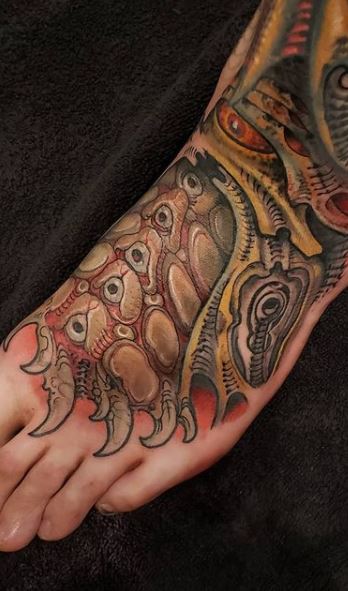 Biomechanical tattoos on legs