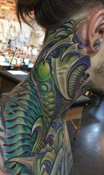 Biomechanical tattoos on the neck