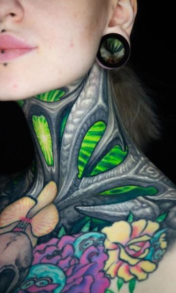 Biomechanical tattoos on the neck