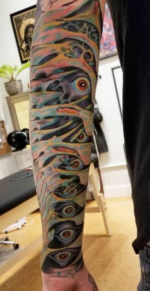 Colorful biomechanical tattoos