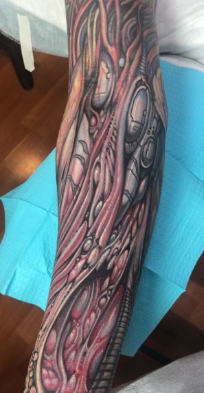 Biomechanical tattoos on the forearm