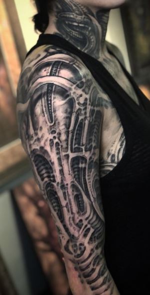 Black and gray biomechanical tattoos