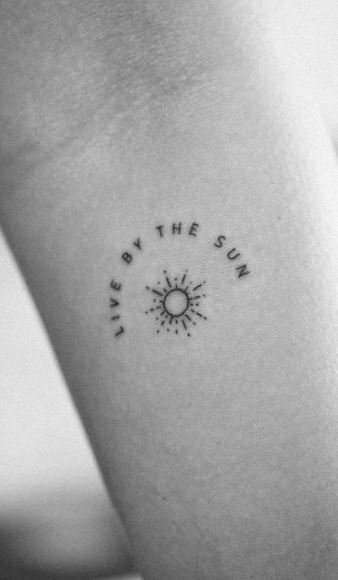 Tattoo with the inscription Living in the Sun