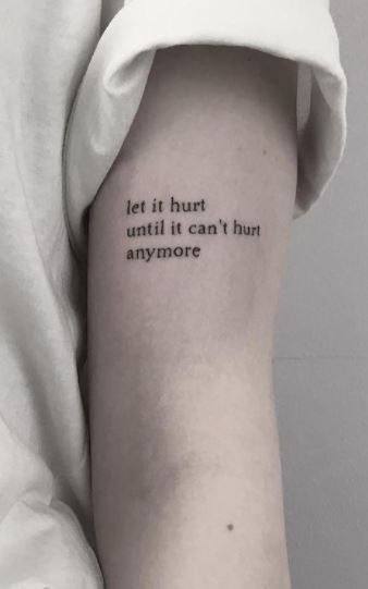 Tattoo with the inscription Let it hurt until it stops hurting