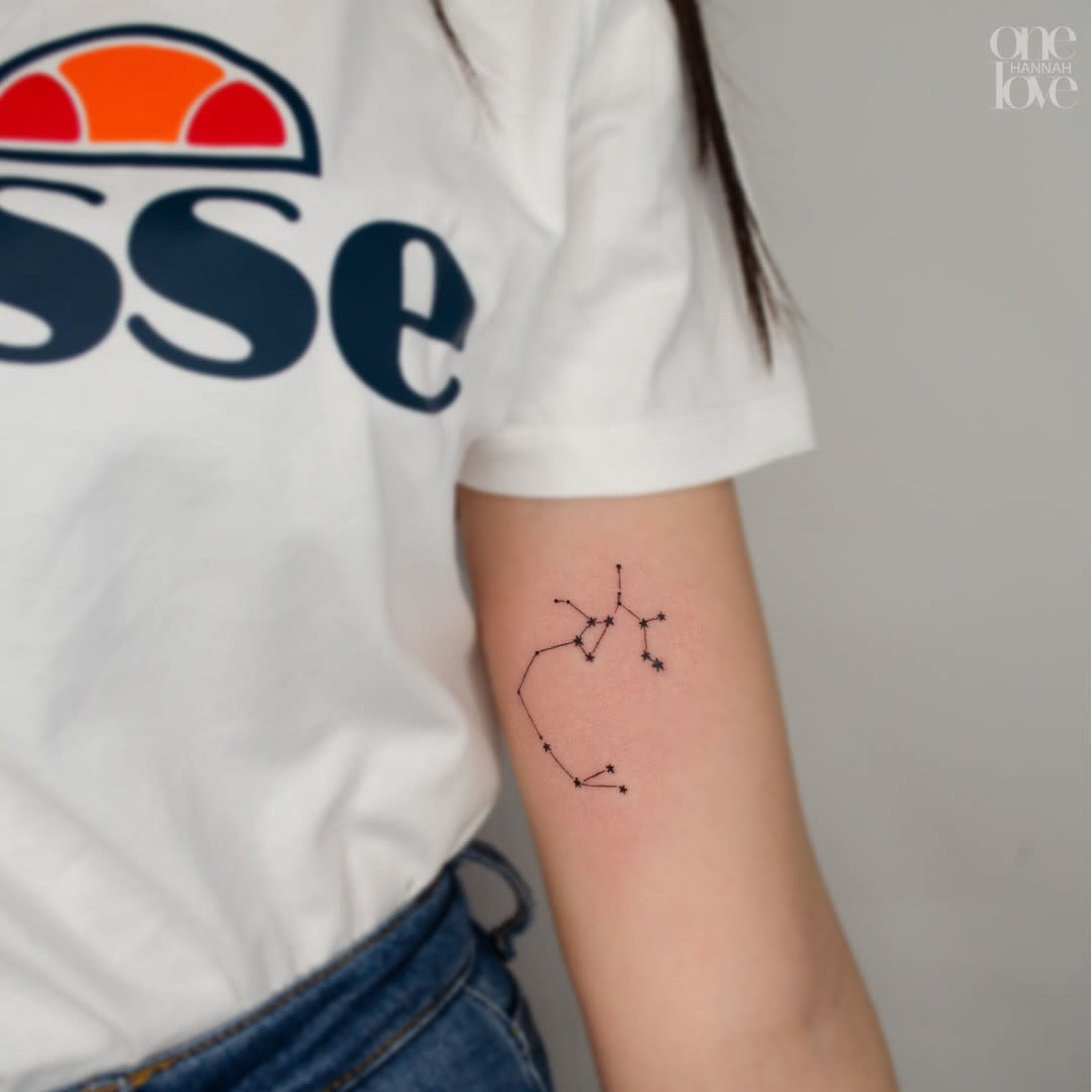 Tattoos of the constellation Sagittarius on the arm