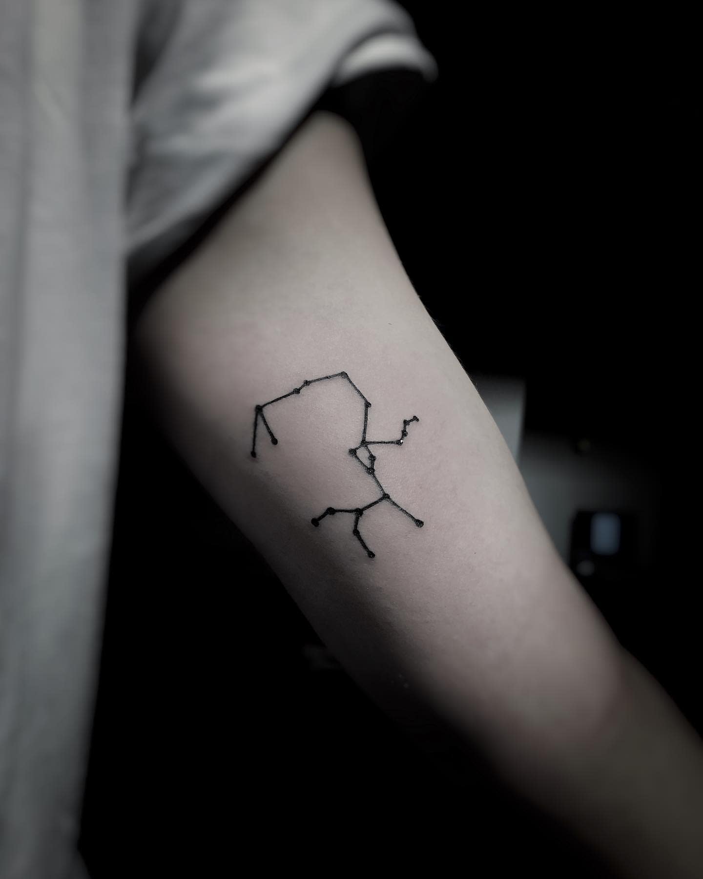 Tattoos of the constellation Sagittarius on the arm