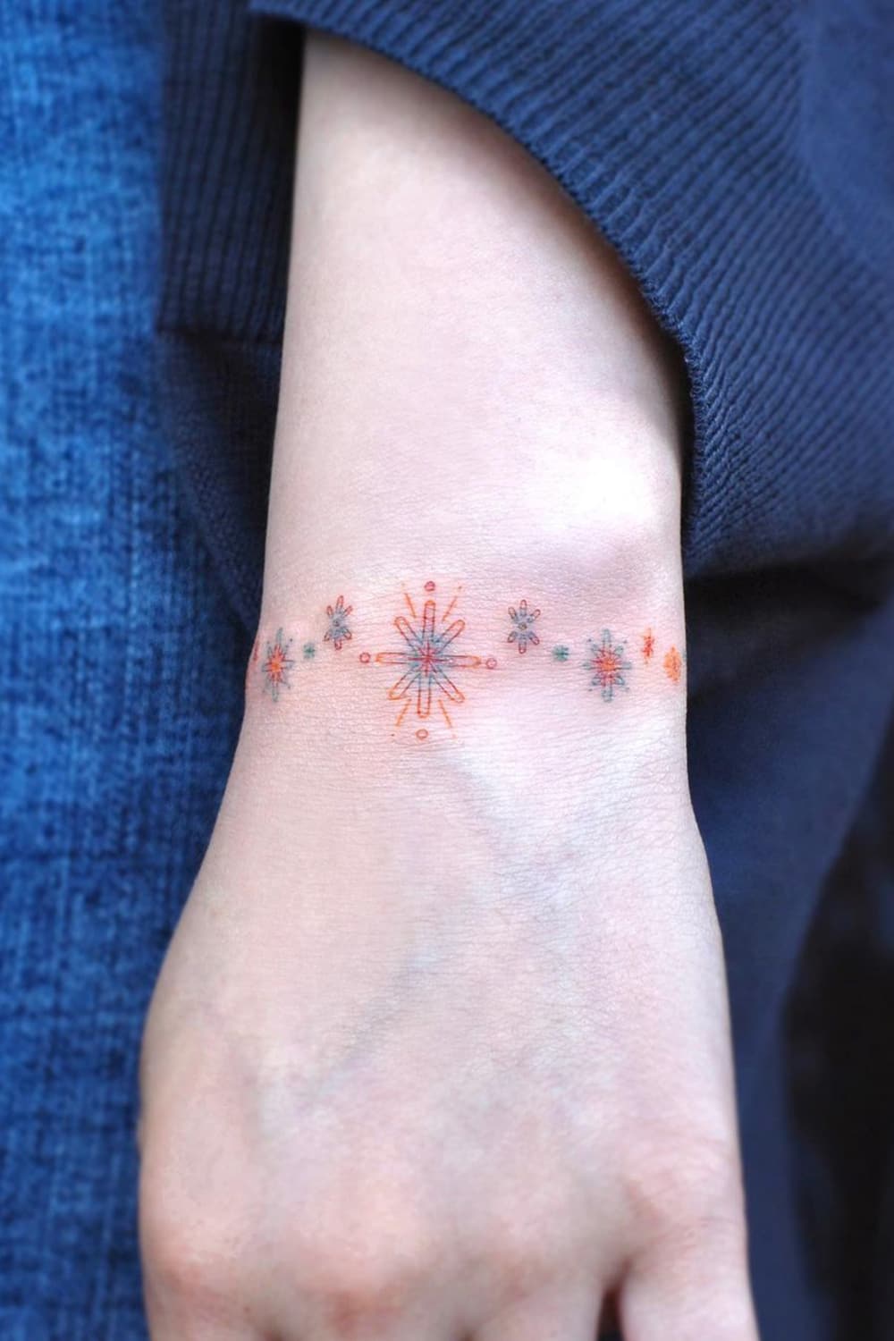 Symbolic Flower Bracelet Tattoo