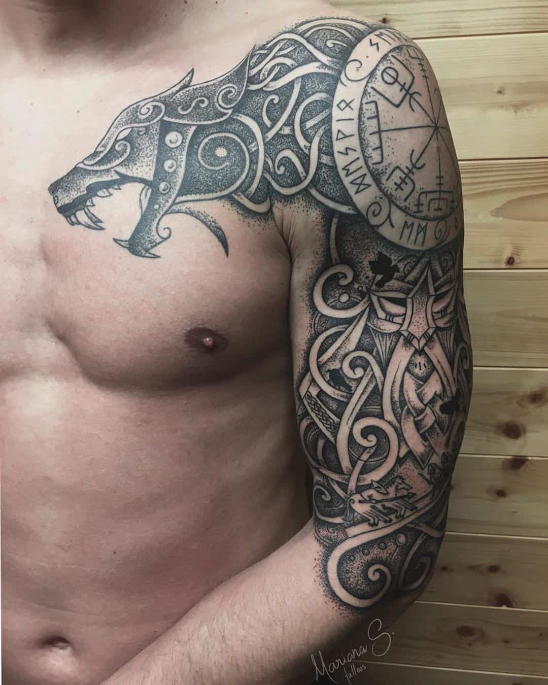 Mystical Scandinavian tattoos with a Celtic dragon on the sleeve