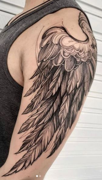 Tattoos of angel wings on the arm