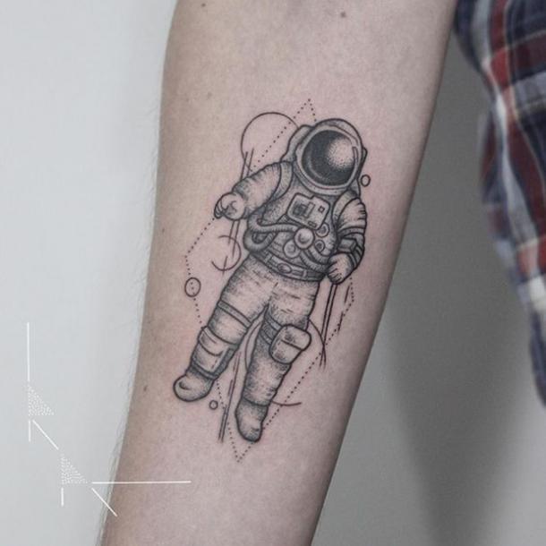 Tattoo of an astronaut in Dotwork style in full gear