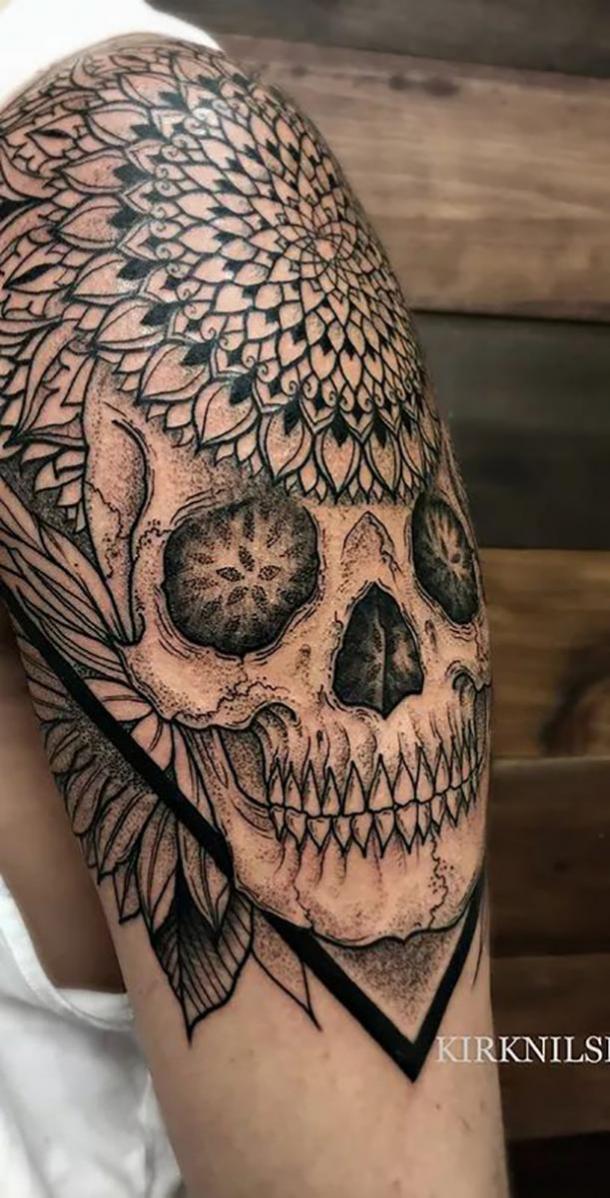 Skull tattoo with floral headdress