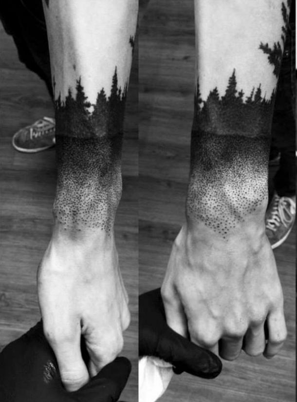 Tree line tattoo and lake dot tattoo around the arm