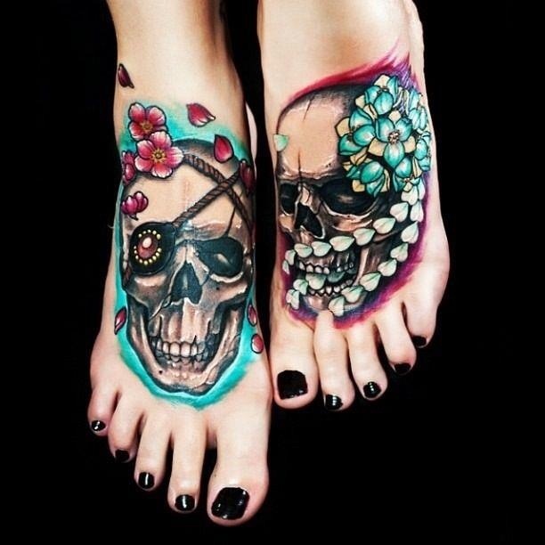 Tattoo of skulls on legs