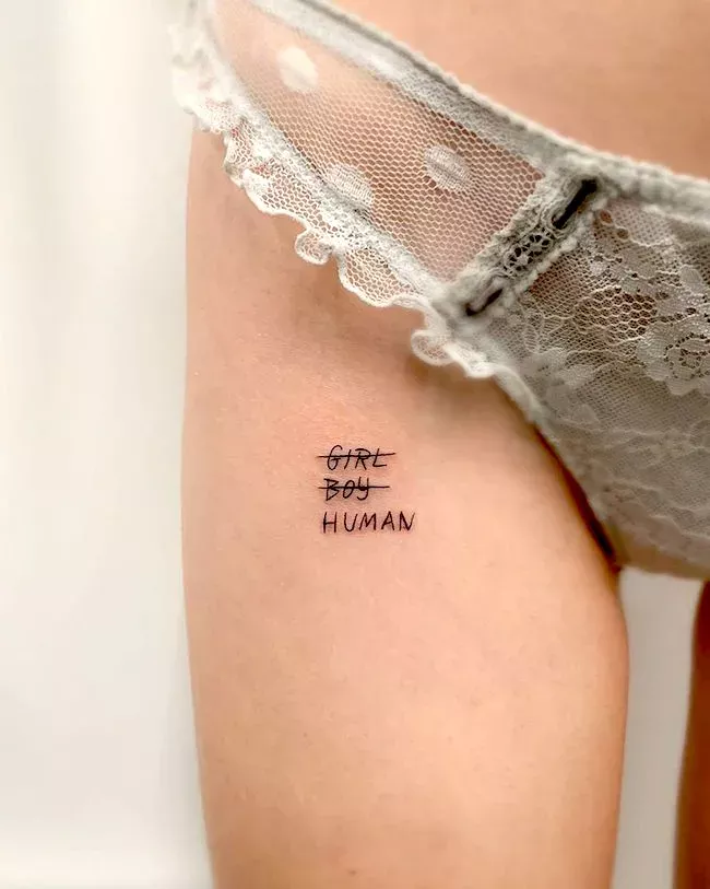 Tattoo with the inscription Human