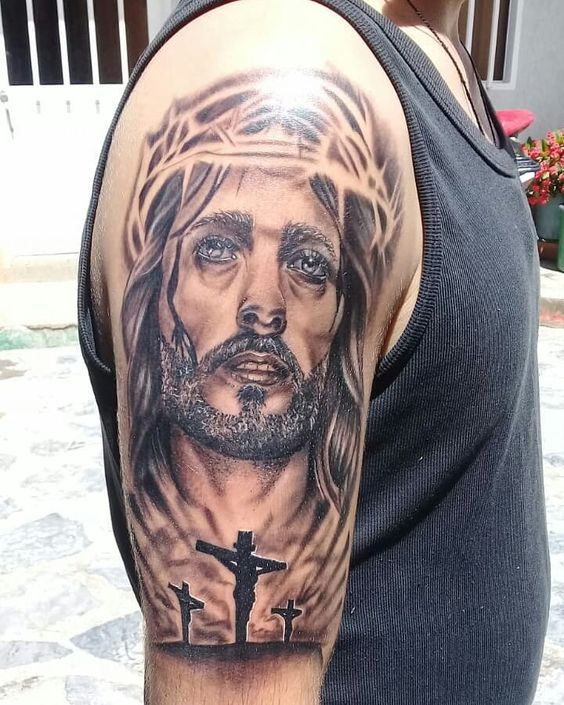 Tattoo of Jesus on the shoulder