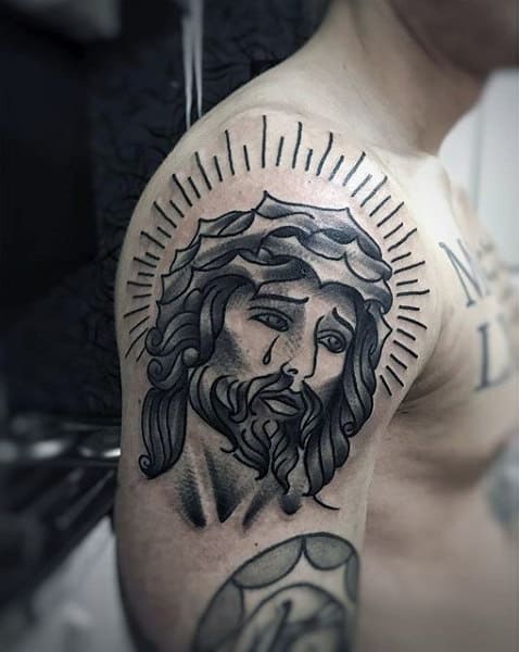 Tattoo of Jesus on the shoulder