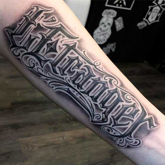 Calligraphy style tattoo on forearm