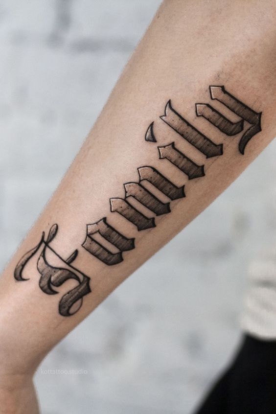 Calligraphy style tattoo on forearm