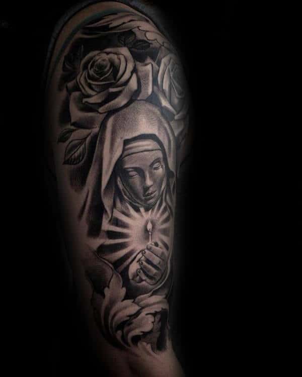 chicano-style religious tattoo on the arm