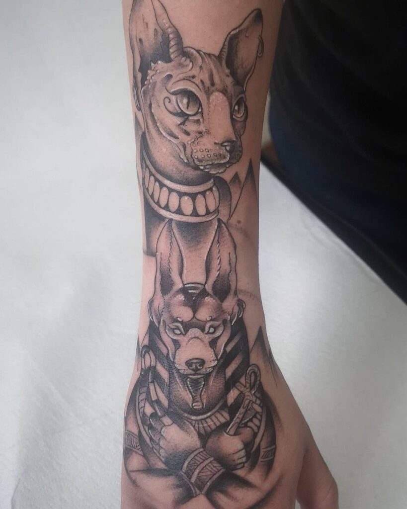 Anubis tattoo on his arm