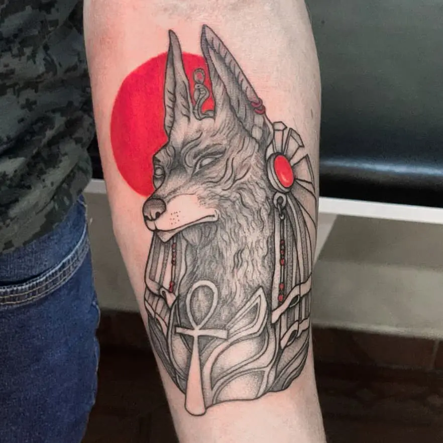 Anubis tattoo on his arm