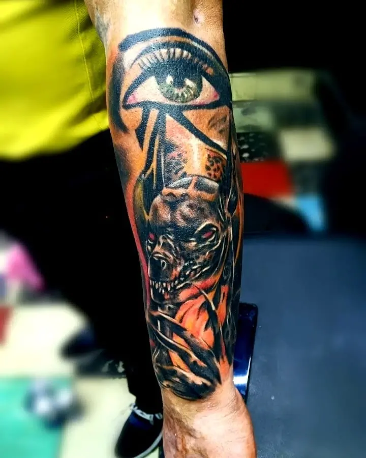 Anubis tattoo on his arm