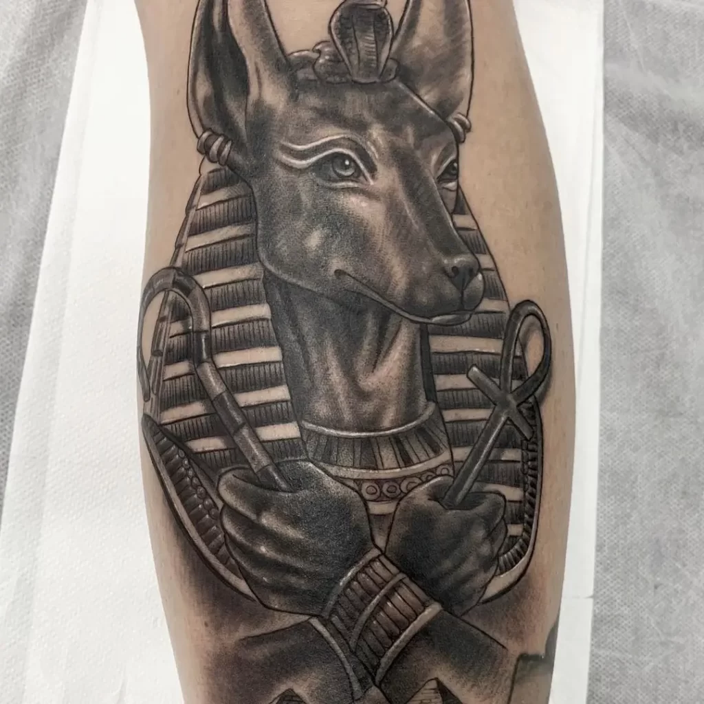 Tattoo of Anubis on the leg