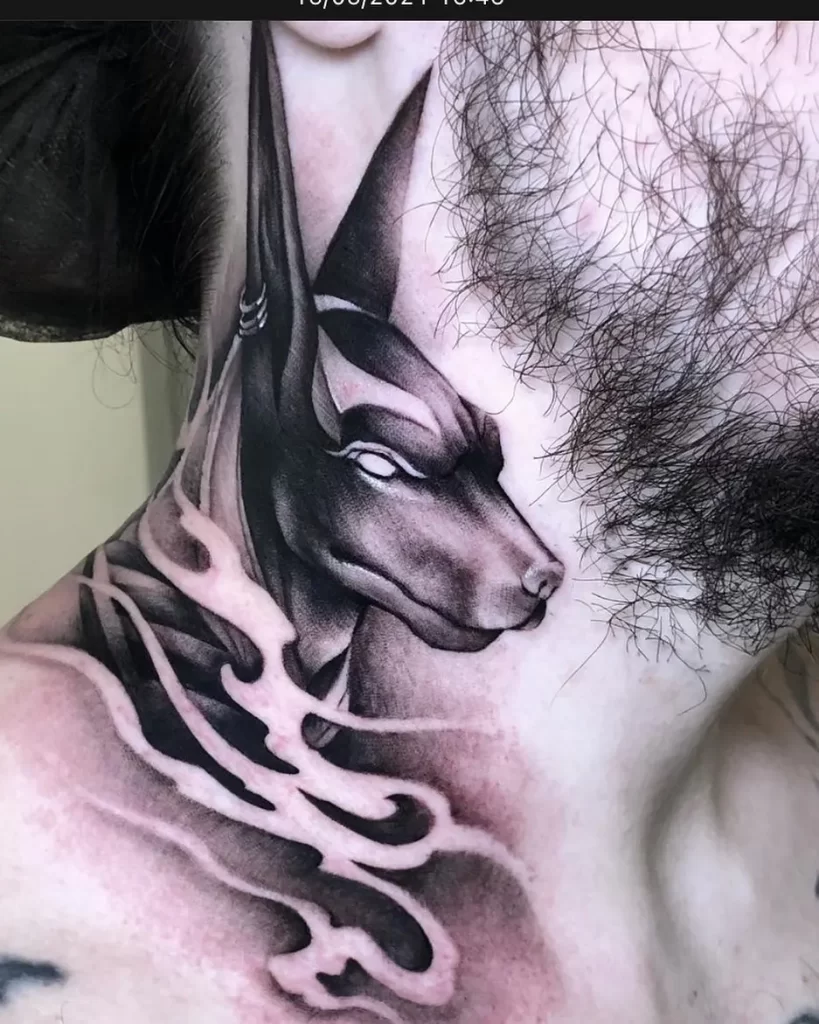 Tattoo of Anubis on the neck