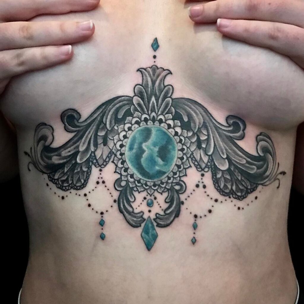 Baroque tattoo under the chest