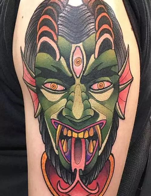 Demon tattoo on bicep