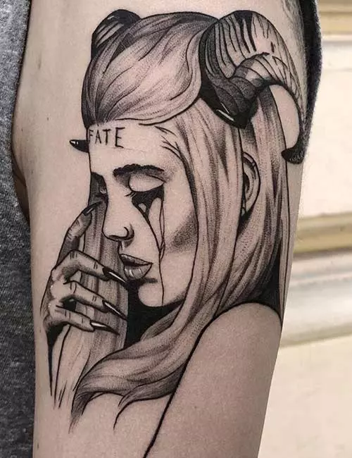 Tattoo of a demon on the shoulder