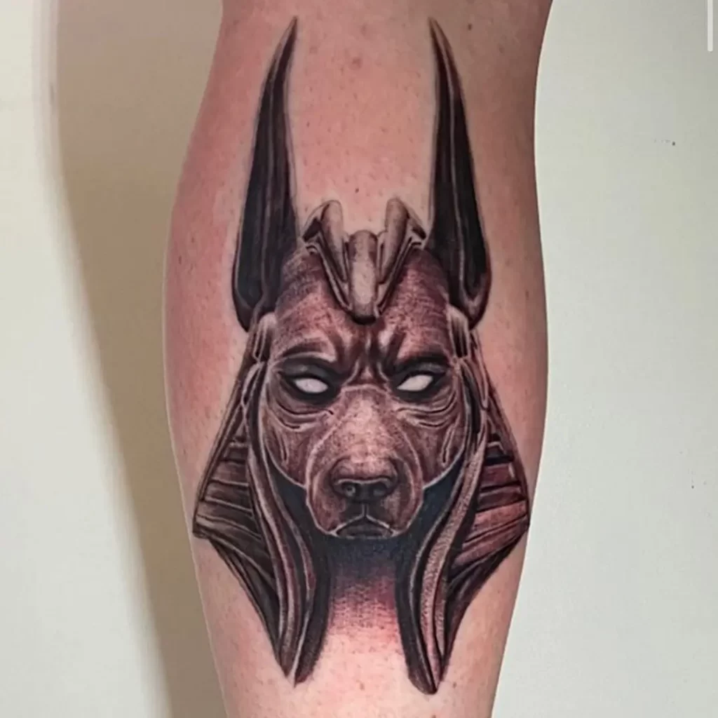 Anubis tattoo on the leg