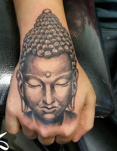 Buddha tattoo on the arm