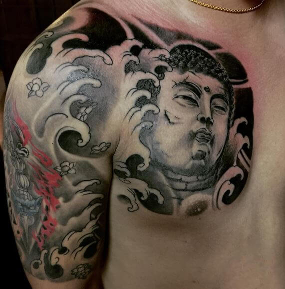 Buddha tattoo on the chest