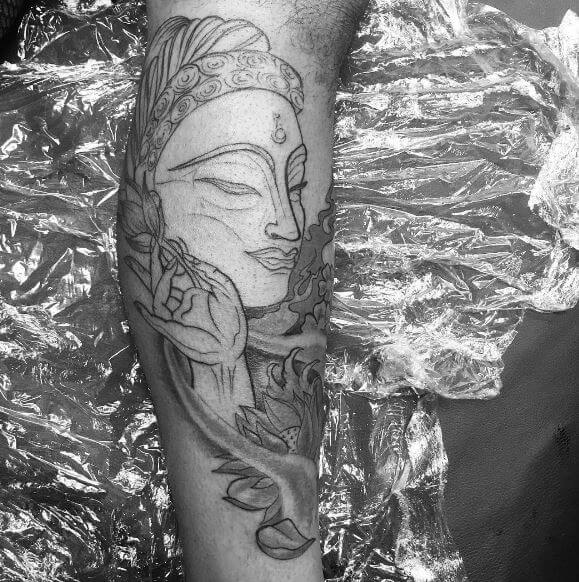 Buddha tattoo on the arm