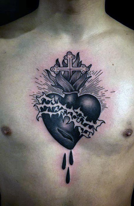 Tattoo of a cross in the shape of a heart