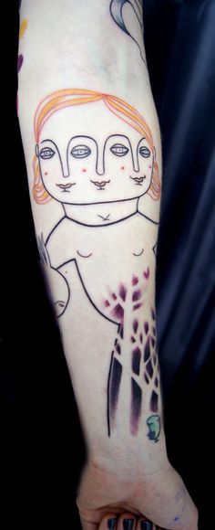 Tattoos in the Art Brut style on the arm