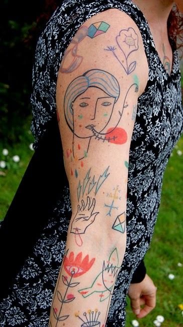 Tattoos in the Art Brut style on the arm