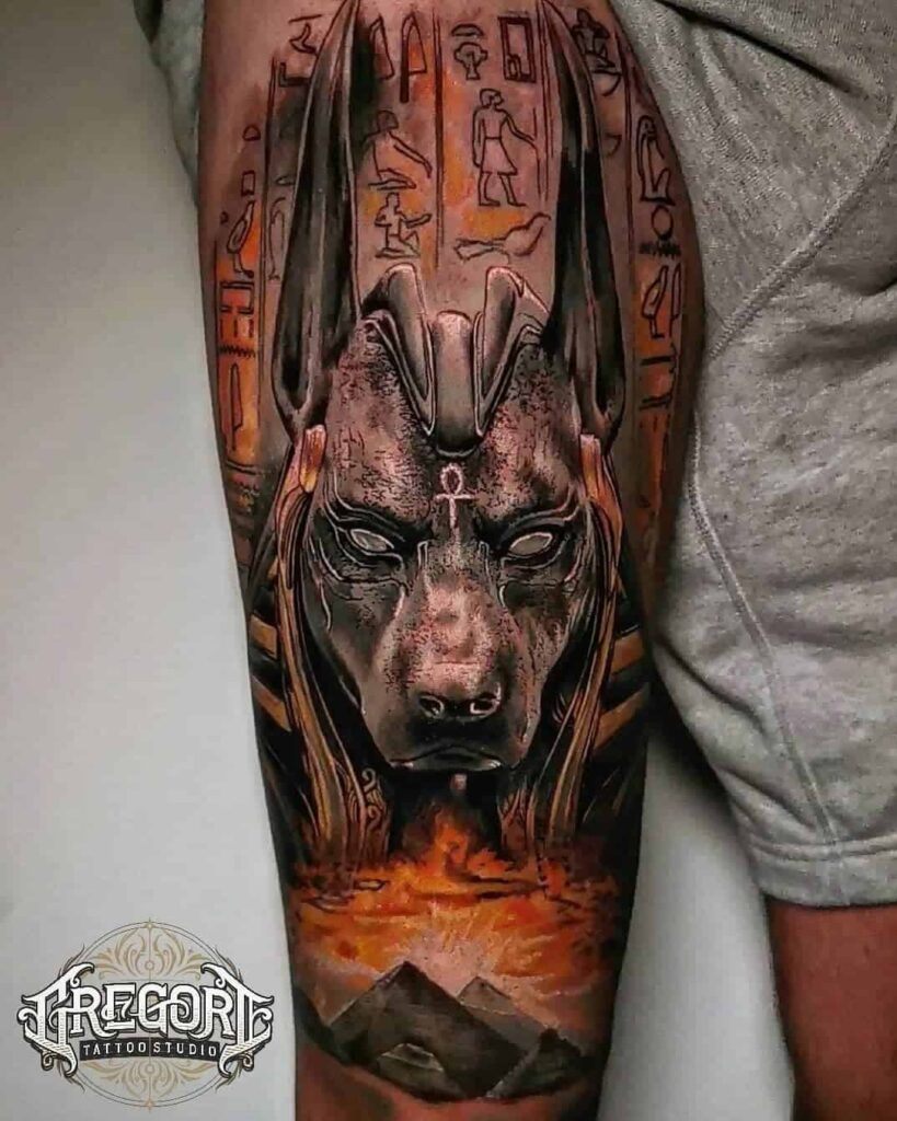 Large Anubis print tattoo on forearm