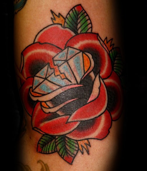 Tattoo of a rose with a diamond in color