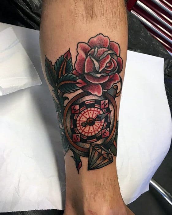 Tattoo of a diamond with flowers on the hand