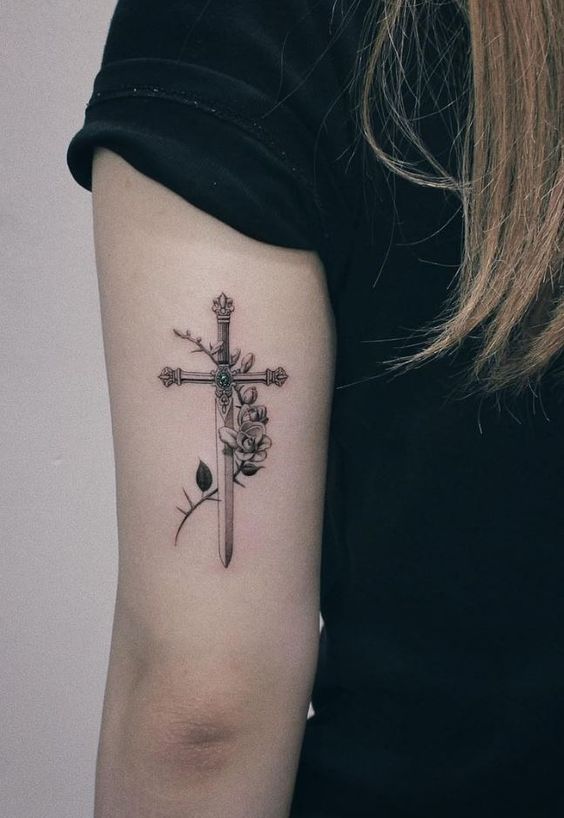 Tattoo of a cross on your arm