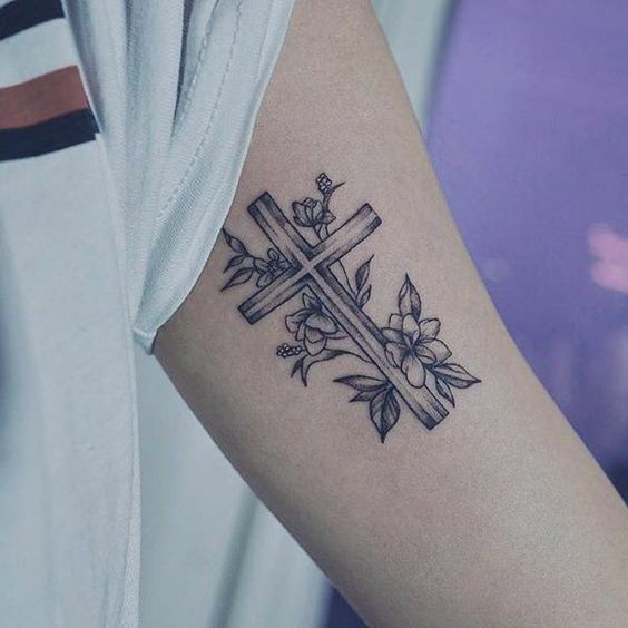 Tattoo of a cross on your arm